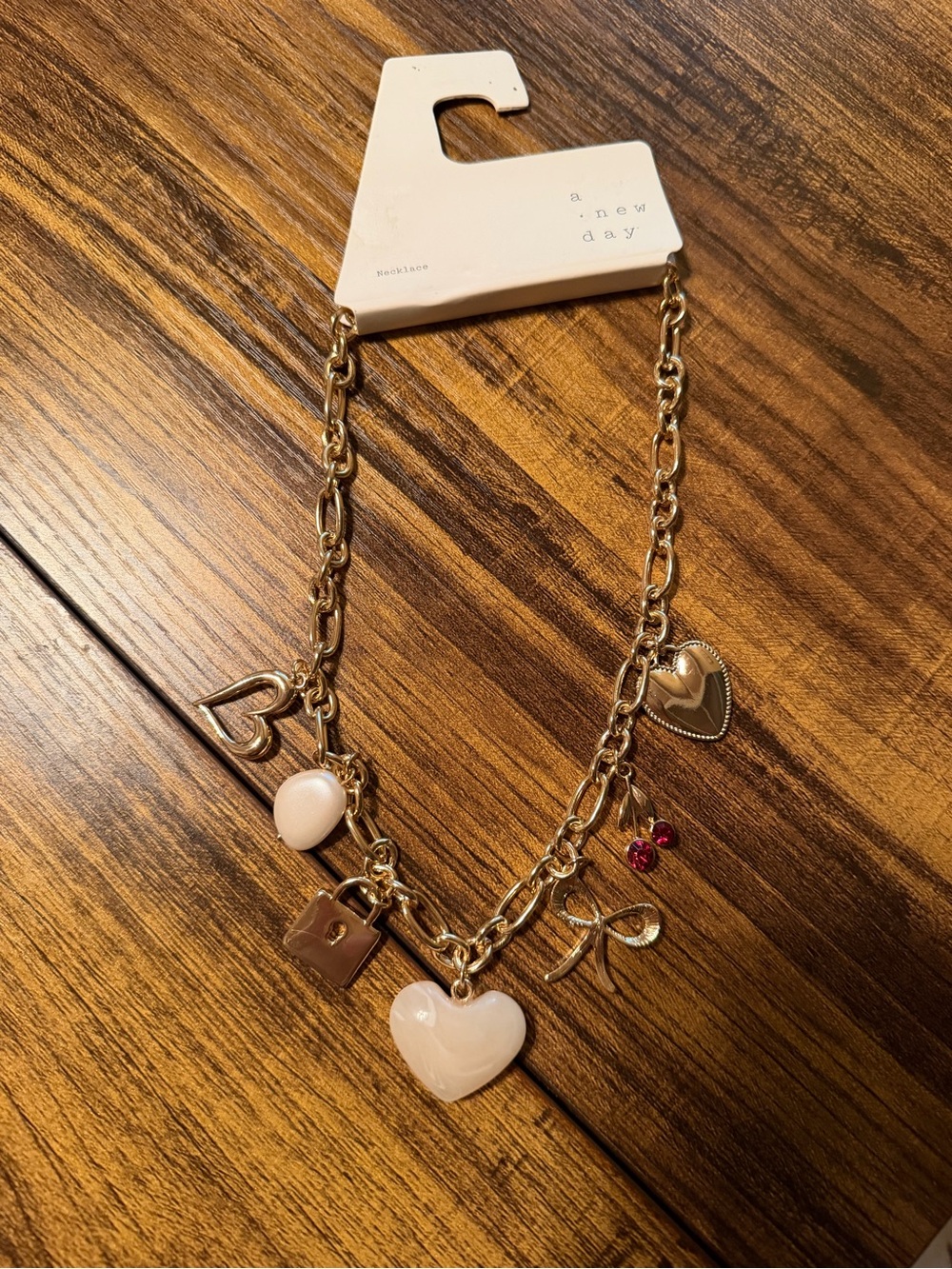 a new day Gold Necklace with Charms
